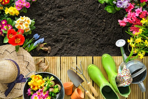 Professional landscapers working on a residential garden project in Willesden